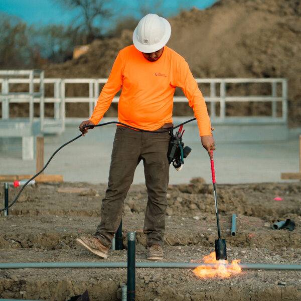 Electrical contractor coordinating utility installation and site preparation on a Texas construction project