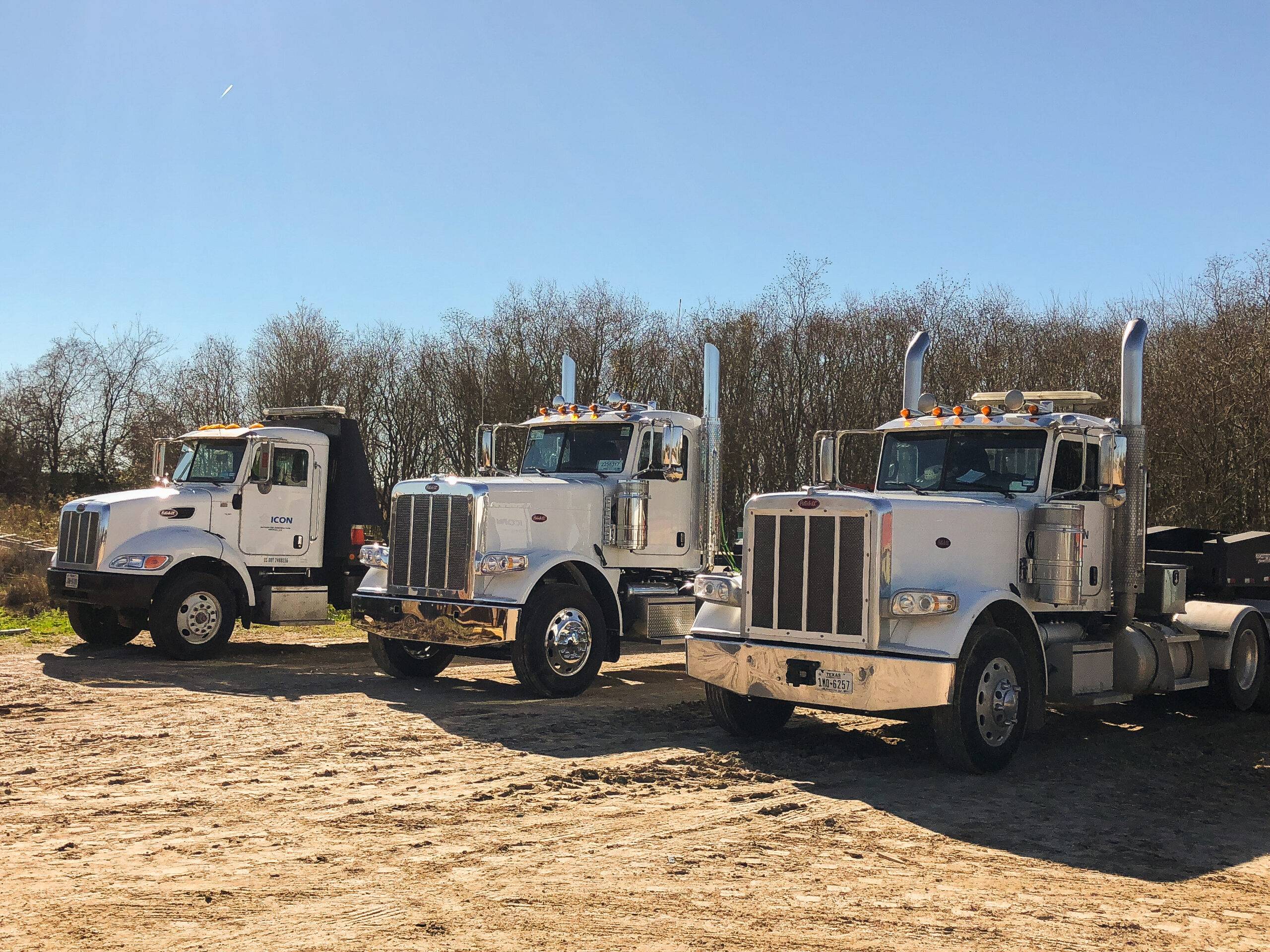 Construction logistics fleet supporting equipment and material transportation for Texas infrastructure projects