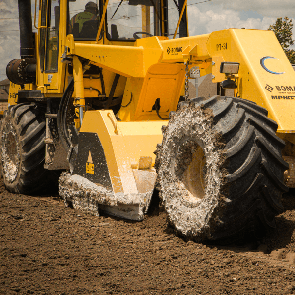 Motor grader performing roadway preparation and grading for a Texas infrastructure project