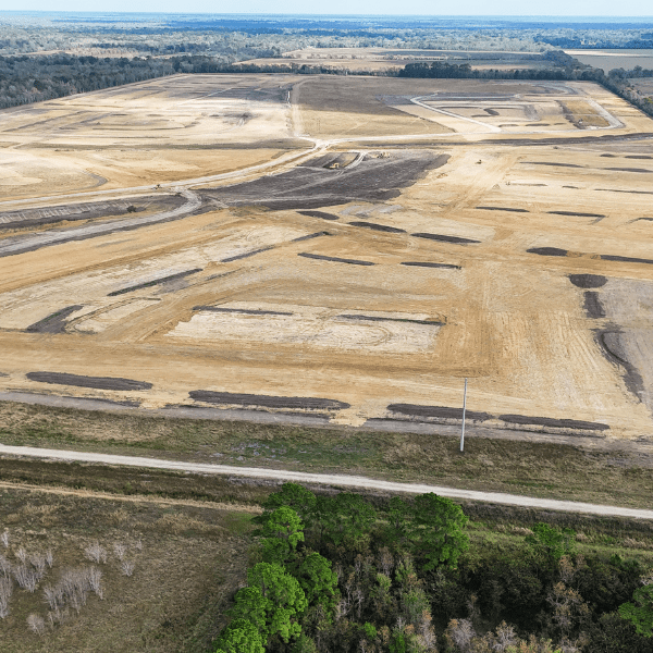 Aerial view of mass grading and site balancing for a large commercial development in Texas