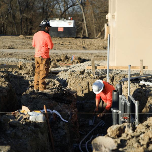 Electrical crews installing underground utility infrastructure for a Texas commercial development